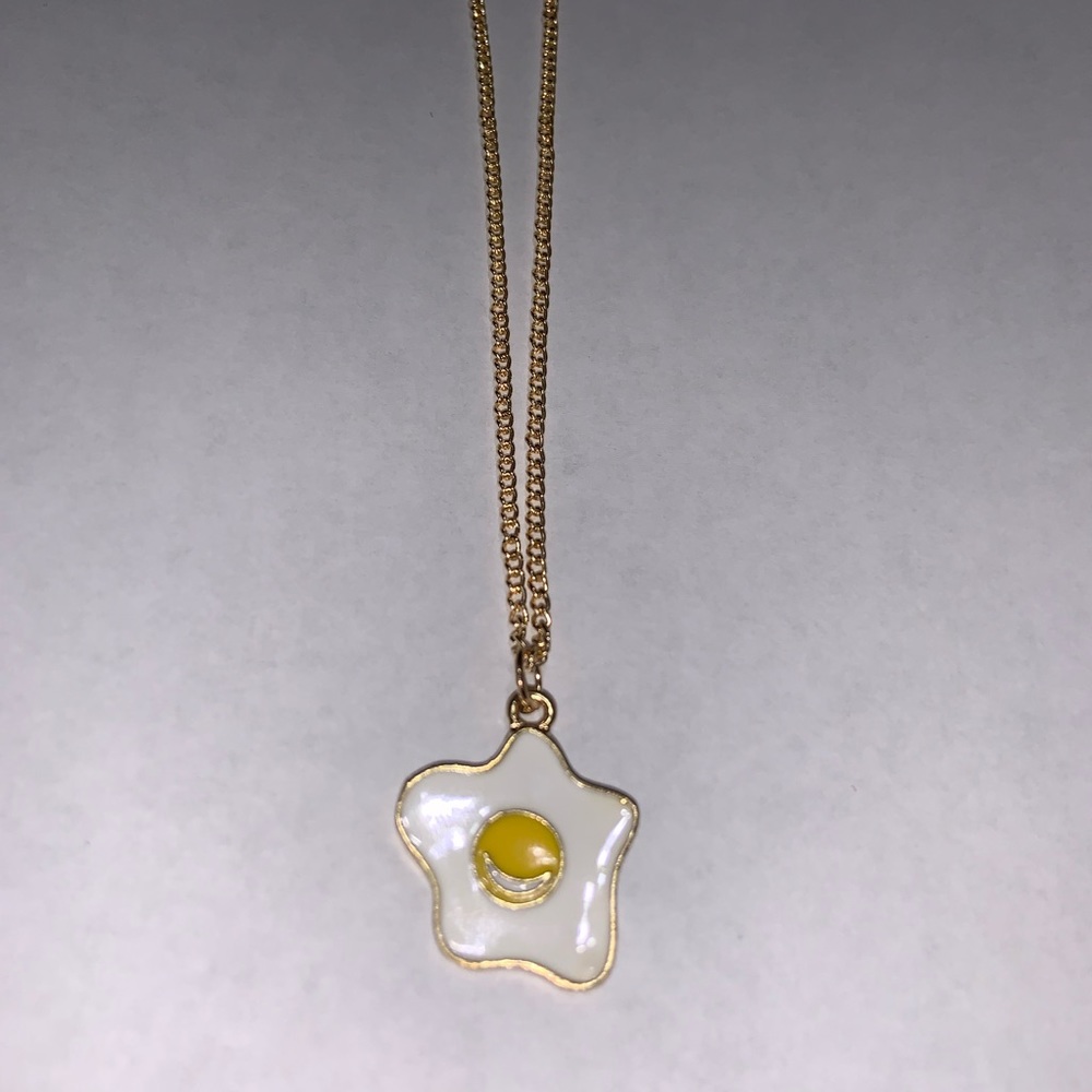 Egg pendant necklace with gold chain